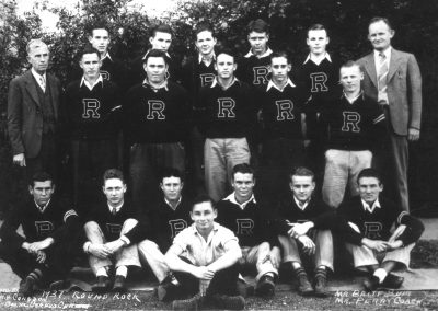 1937 Round Rock football team with coaches wearing letterman sweaters